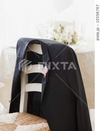 Grooms suit jacket on chair at wedding, studio shot Grooms suit jacket on chair at wedding, studio shot 10506767