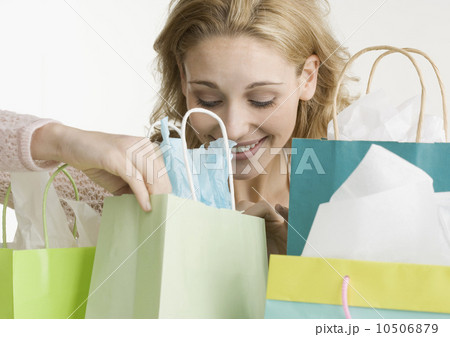 Woman looking in shopping bags 10506879