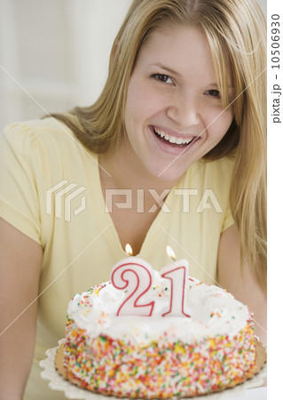 Portrait of woman with Twenty First birthday cake Portrait of woman with Twenty First birthday cake 10506930