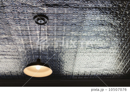 Pendant lamp on tiled ceiling 10507076
