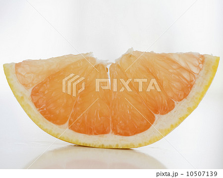Slice of fresh grapefruit Slice of fresh grapefruit 10507139