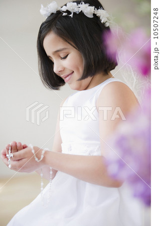 Portrait of girl (8-9) celebrating Fist Communion 10507248