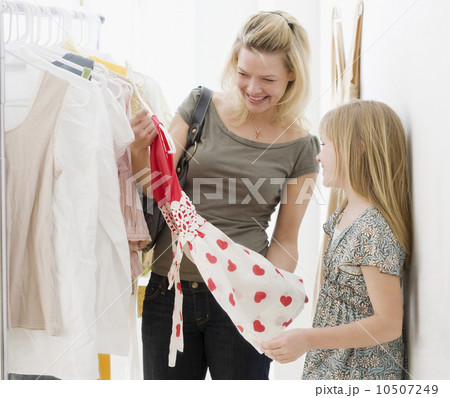 Mother and daughter clothing shopping 10507249