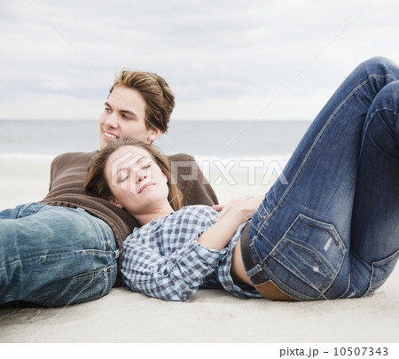 Couple resting on beach 10507343