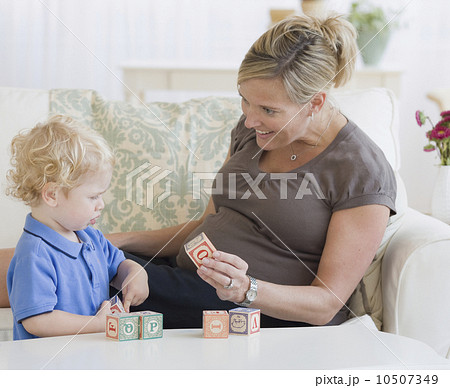 Pregnant mother playing with toddler 10507349