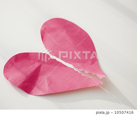 Paper heart ripped in half 10507416