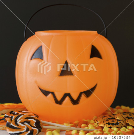 Jack-o-lantern pail and Halloween candy Jack-o-lantern pail and Halloween candy 10507534