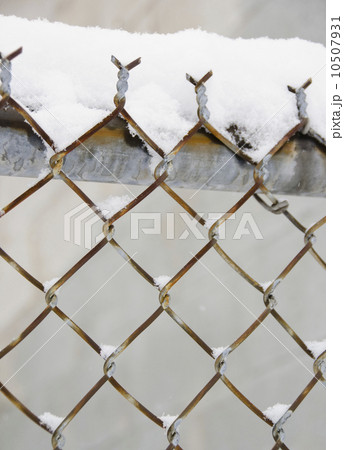 USA, New York State, Brooklyn, Williamsburg, snow covered chainlink fence 10507931
