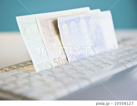 Studio shot of banknotes in computer keyboard Studio shot of banknotes in computer keyboard 10508127