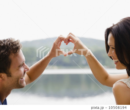 Roaring Brook Lake, Couple making heart shape with hands 10508194