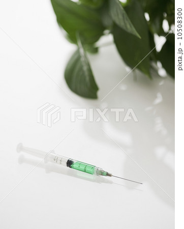 Syringe filled with green liquid Syringe filled with green liquid 10508300