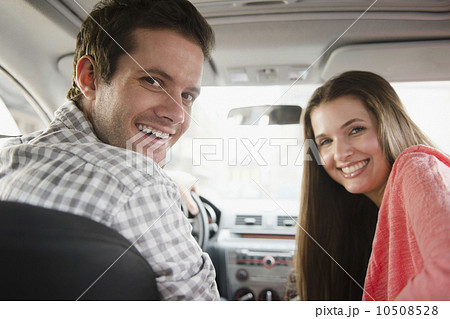 Happy young couple sitting in car Happy young couple sitting in car 10508528