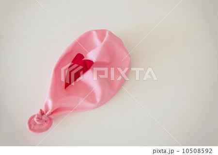 Studio Shot of deflated pink balloon 10508592
