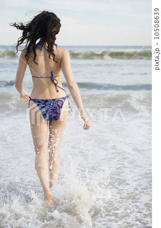 Woman wading in sea Woman wading in sea 10508639