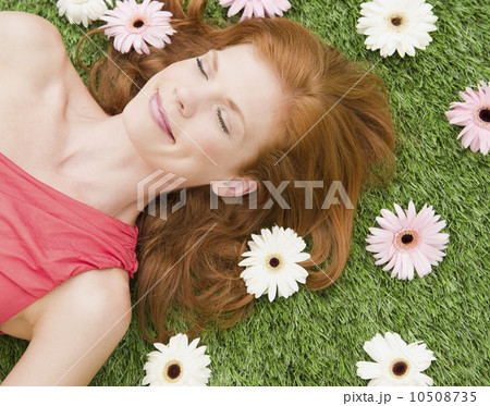 Beautiful woman relaxing on grass 10508735