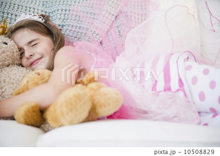 Girl ( 6-7) sleeping in costume and crown 10508829