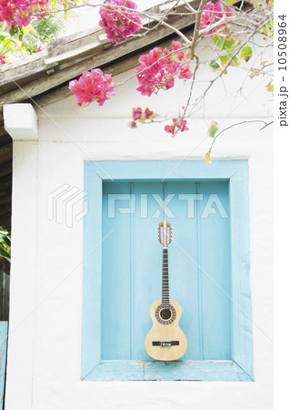 Brazil, Bahia, Trancoso, Guitar against building wall Brazil, Bahia, Trancoso, Guitar against building wall 10508964