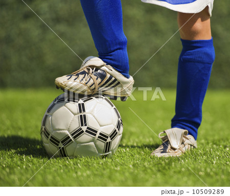Low section of boy (10-11) playing soccer Low section of boy (10-11) playing soccer 10509289