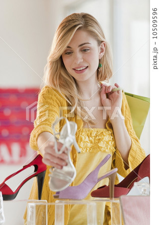 Young woman shopping in shoe shop 10509596