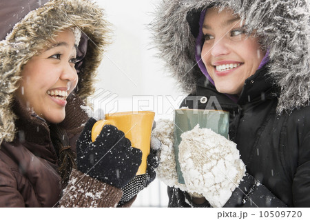 Two young women drinking hot chocolate Two young women drinking hot chocolate 10509720