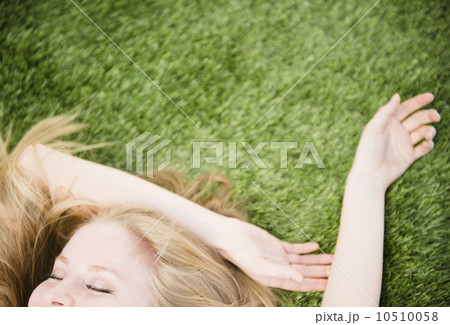 Woman lying on grass 10510058