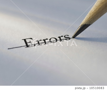 Studio shot of pencil crossing out the word errors from piece of paper 10510083