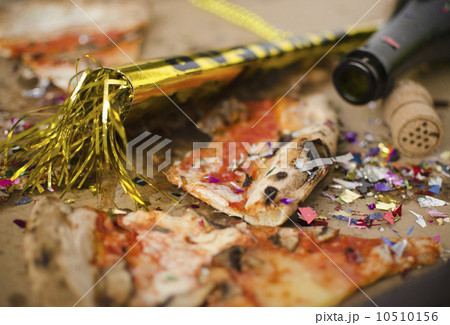 Slices of pizza and confetti in in box 10510156