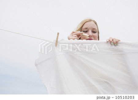 Young woman doing laundry 10510203