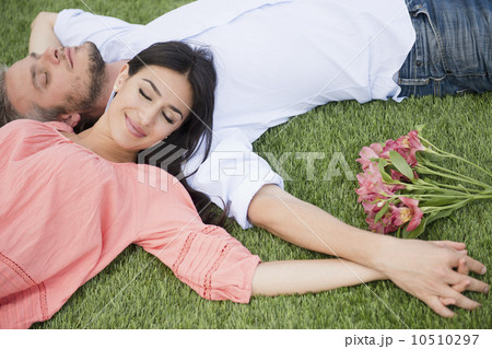 Couple lying together on grass 10510297