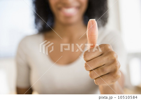 Woman making thumbs up gesture Woman making thumbs up gesture 10510584