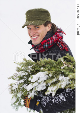 Man carrying Christmas tree Man carrying Christmas tree 10510731