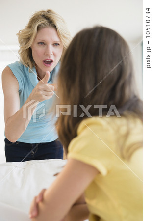 Mother and daughter (8-9 years) arguing 10510734