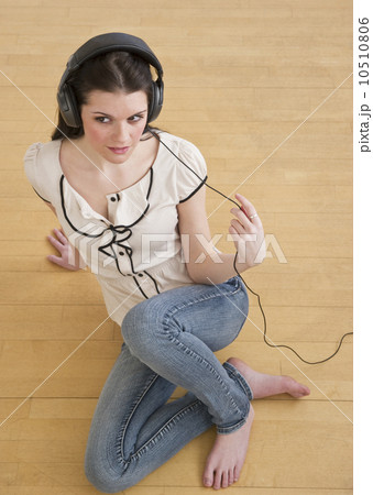 Woman wearing headphones Woman wearing headphones 10510806