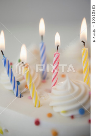Studio shot of birthday cake with lit candles 10510885