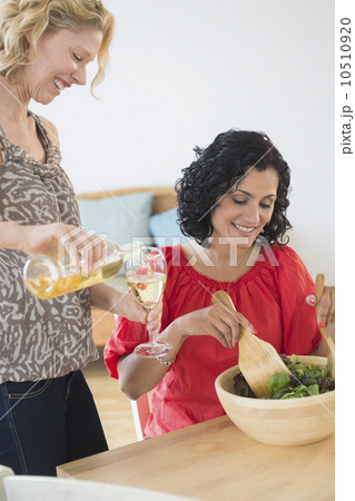 Female friends preparing salad Female friends preparing salad 10510920