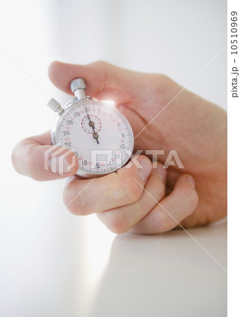 USA, New Jersey, Jersey City, hand holding stopwatch USA, New Jersey, Jersey City, hand holding stopwatch 10510969