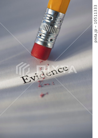Studio shot of pencil erasing the word evidence from piece of paper Studio shot of pencil erasing the word evidence from piece of paper 10511333