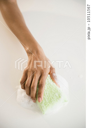 Close up of woman's hand cleaning with sponge Close up of woman's hand cleaning with sponge 10511567