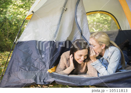 Two women lying in tent 10511813