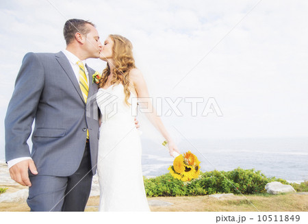 Portrait of married couple kissing 10511849