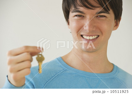 Man holding key Man holding key 10511925