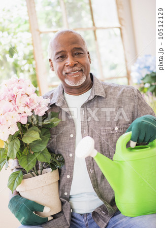 Portrait of man working in greenhouse 10512129