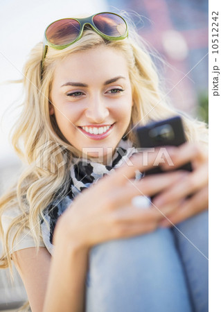 Teenage girl (16-17) using cell phone Teenage girl (16-17) using cell phone 10512242