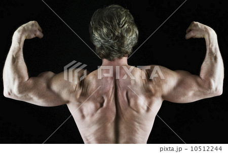 Muscular man flexing his biceps Muscular man flexing his biceps 10512244