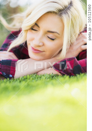 Teenage girl (16-17) sleeping on grass Teenage girl (16-17) sleeping on grass 10512360