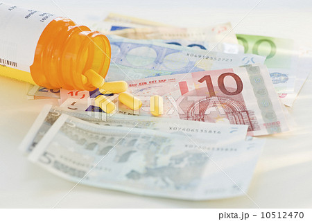 Pill bottle with bank notes 10512470