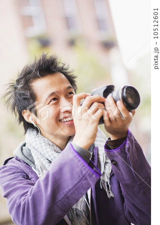 Teenage boy (16-17) with camera Teenage boy (16-17) with camera 10512601