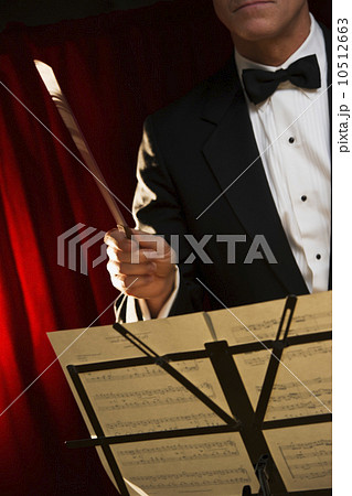Midsection of orchestra conductor 10512663