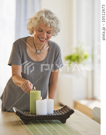 Woman lighting candles 10512673