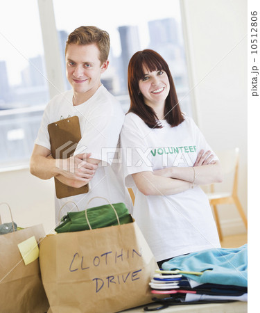 Portrait of volunteers organizing clothing drive 10512806